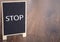 Stop text chalkboard on table