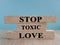 STOP Toxic love concept. Words on brick blocks with letters, the time is now concept,