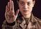 Stop, war and hand of a military woman angry, frustrated and with sign against a dark black studio background. Army