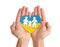 Stop war in Ukraine. Man holding heart with colors of Ukrainian flags and paper family in hands on white background, closeup