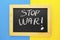 Stop War in Ukraine words on chalckboard frame. Ukraine blue and yellow flag