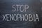 STOP XENOPHOBIA writing on a chalkboard