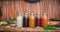 Stopmotion of many different Jamu drinks- Indonesian herbal beverage in glass bottles with natural ingredients: turmeric