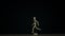 Stopmotion running wooden figure dummy rotates in studio on black background