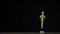 Stopmotion running wooden figure dummy in studio on black background rotates with freezed motion for titles