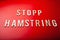 Stopp hamstring norwegian word text wooden letter on red background coronavirus covid-19