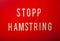 Stopp hamstring norwegian word text wooden letter on red background coronavirus covid-19