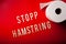 Stopp hamstring norwegian word text wooden letter toilet paper on red background coronavirus covid-19