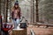 Stopping for a quick break. a young woman camping in the wilderness during winter.