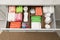 Storage of different feminine hygiene products in drawer indoors, top view