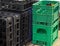 Storage with empty bottle crates. Ready to charge black and green crates for soda, beer or wine