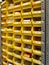 Storage equipment. Many yellow drawers on shelves for storing small tools and items at home, in the garage, in the