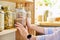 Storage of food in the kitchen in pantry, woman& x27;s hands with jar of buckwheat