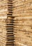 Storage of piles of wooden boards on the sawmill. Boards are stacked in a carpentry shop. Sawing drying and marketing of