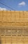 Storage of piles of wooden boards on the sawmill. Boards are stacked in a carpentry shop. Sawing drying and marketing of