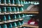 Storage room with slippers shoes on shelves in family run firm