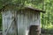 Storage shed at the edge of a forest