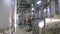 Storage Tanks in Brewery. Brewing factory indoors. Steadycam shot.