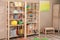 Storage for toys in colorful child`s room. Idea for interior