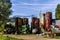 Storage yard and scrap collecting area for old agricultural equipment, silos, tractors and other scrap around barn and warehouse