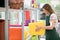 Store assistant at a nursery loading shelves