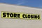 Store Closing sign close up on the side of a business