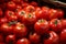 Store drawer stocked with a myriad of ripe, vibrant tomatoes