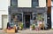 Store front of The Shop at Forty which sells Retro and Vintage wares with stock outside on the pavement.