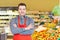 Store manager with arms crossed in supermarket