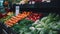 Store shelf filled with a variety of colorful and juicy vegetables such as tomatoes, zucchini, carrots, and many more.