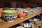 Store shelf with traditional Asian dinnerware like ceramic rice bowls or soup dishes