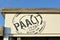 Store sign of beach souvenir shop and restaurant `Paal 17` in front of blue sky