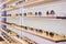 Storefront shelves of various modern sunglasses at the airport`s retail store