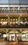 Storefronts on three stories of decorative Victorian shopping arcade of Queen Victoria Building QVB in Sydney CBD, Australia