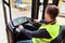 Storehouse employee in uniform working on reachtruck in modern automatic warehouse. Warehousing, machinery concept. Logistics in