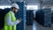 Storehouse worker inspecting crates before shipment analysing work process