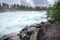 Storforsen, wild, huge waterfall on Pite River in Swedish arctic on a cloudy, rainy day of arctic summer. Norrbottens