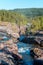 Storforsen, wild, huge waterfall on the Pite River in Swedish arctic on a sunny day of arctic summer. Norrbottens area