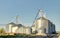 Storing grain in a group of corrugated steel granaries.