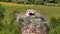 a stork hatches its chicks in nest on top of tall old brick chimney