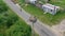 A stork with little chicks in the nest. on a pillar. View from the drone