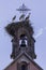 Stork`s nest on church tars of Equisheim, Alsace, France