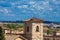 Storks nesting on top of the bell tower of Church of Carmen de Abajo built on the 15th century in the city of Salamanca in Spain