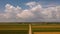 Storm above a agricultural plain country road