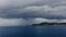 Storm in the Adriatic Sea nearby coast of Croatia, strong heavy rain through catamaran windows, the stormy sky, island