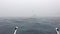 Storm in the Adriatic Sea nearby coast of Croatia, strong heavy rain, the stormy sky, a strong wind, lonely boat on