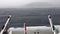 Storm in the Adriatic Sea nearby coast of Croatia, strong heavy rain, the stormy sky, a strong wind, lonely boat on