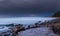 Storm approaching and lightning on the beach.