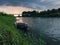 Storm arcus shaft and cumulonimbus cloud with heavy rain or summer shower, severe weather and sun glow behind rain. Landscape with