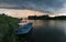 Storm arcus shaft and cumulonimbus cloud with heavy rain or summer shower, severe weather and sun glow behind rain. Landscape with